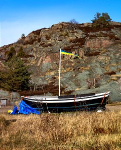Flagpole and small boat in Loddebo photo