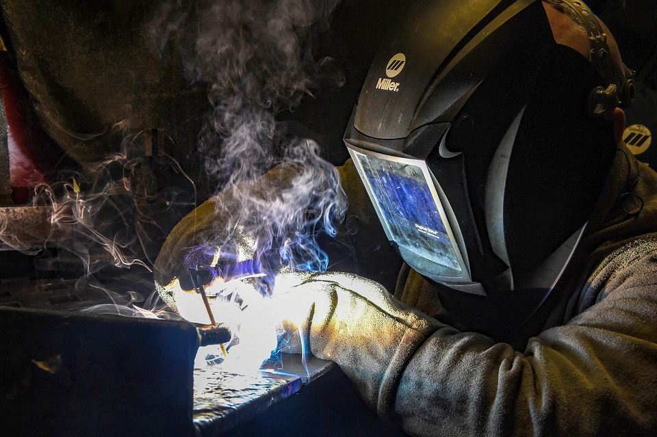 Industrial Worker at the factory welding closeup