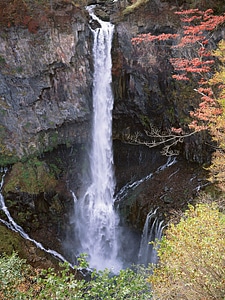 Waterfall and blue stream in the yellow forest