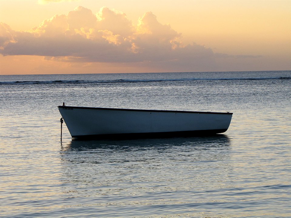 Boat at sunset photo