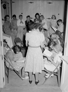 Sunday school lesson at the community house of the Casa Grande Valley Farms. Pinal County, Arizona, historic photo