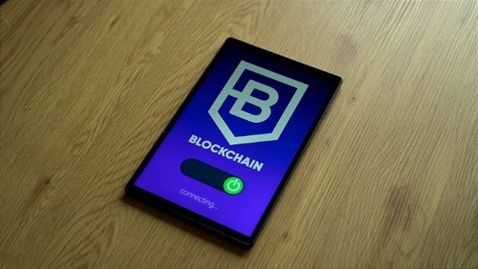 Connecting to a blockchain platform with a smartphone concept photo