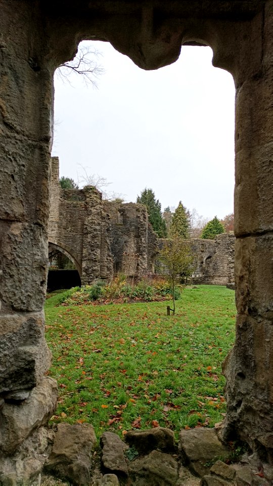 Whalley Abbety vertical stone frame with grass an d sky