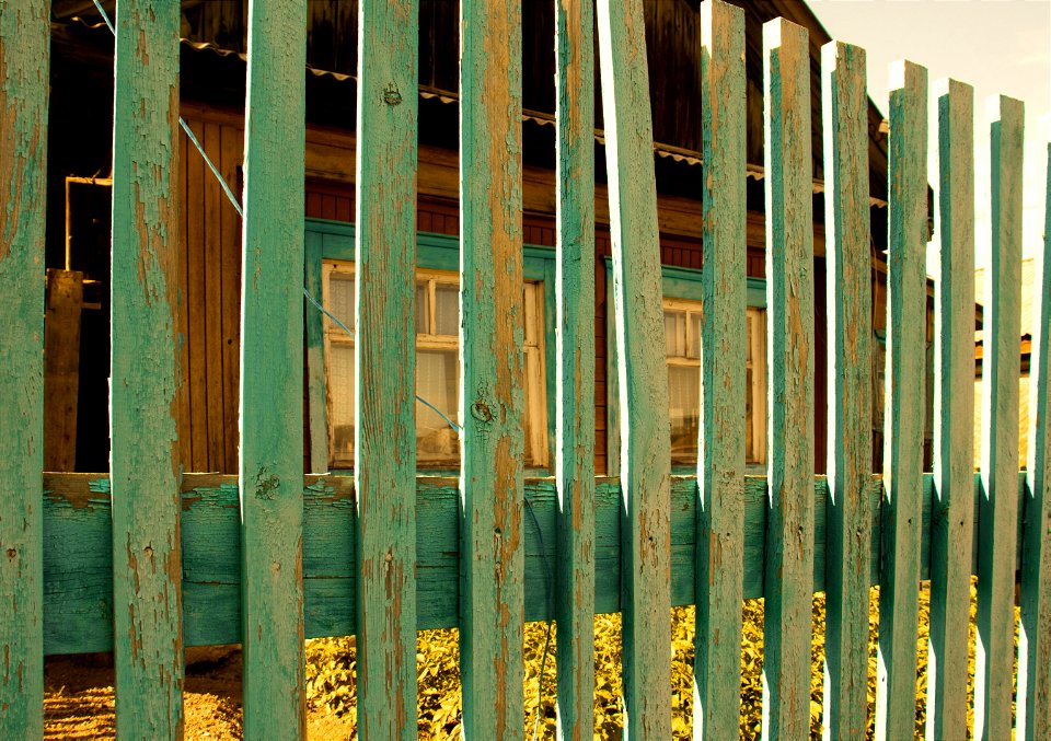 house through a wooden fence