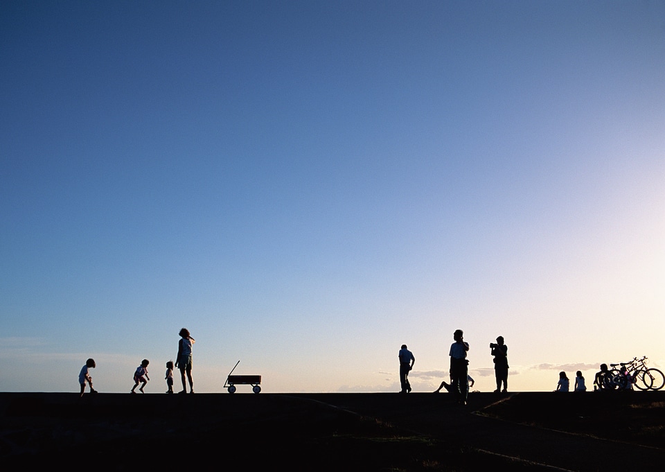 Group of people on sunset beach