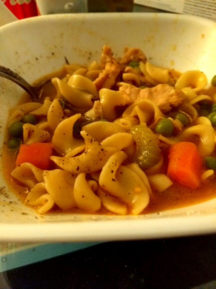 food soup bowl chicken noodle peas carrots