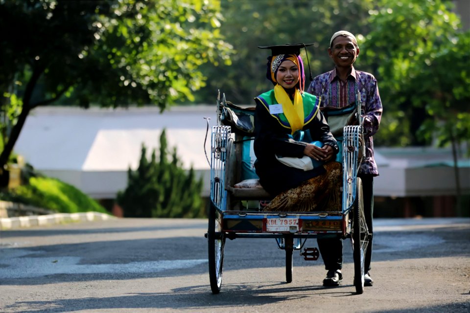 Traditional Rickshaw Driver and His Daughter