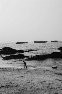 A kid wandering the shore in Essaouira