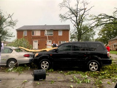 Cars, branches, a porch gone. (PHOTO PFPD)