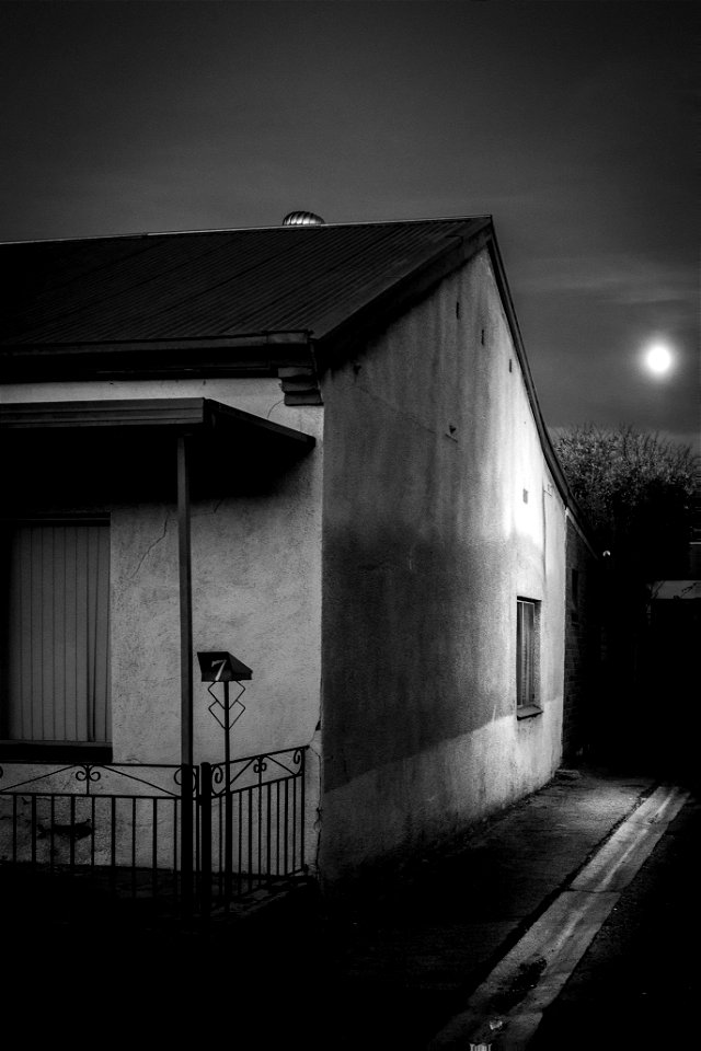 Moonset over cottage.