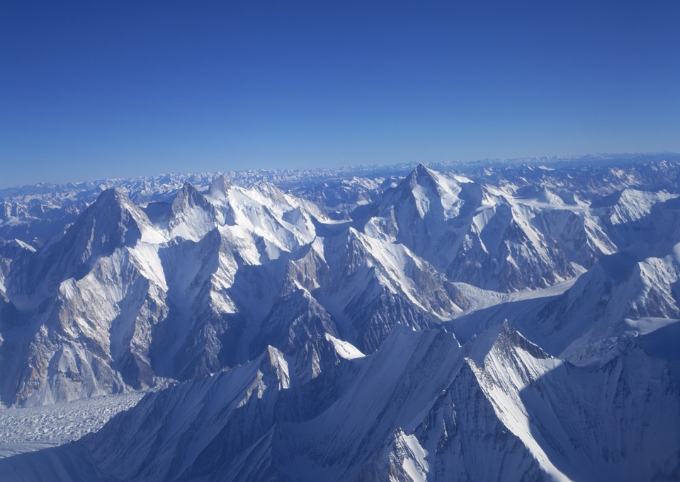 Severe mountains peaks covered by snow