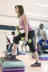 Men And Women Performing Aerobic Exercises photo