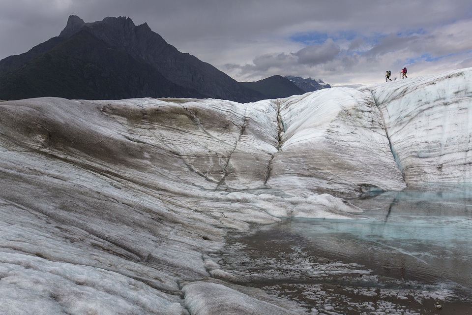 Backpackers Exploring the Root Glacier