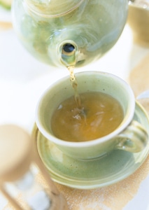 glass teapot flow green tea photo