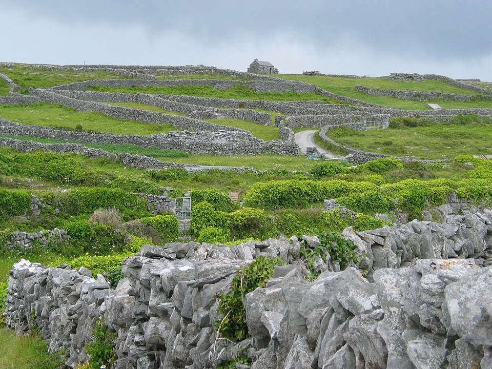 old stone wall fields with blue sky in the aran islands