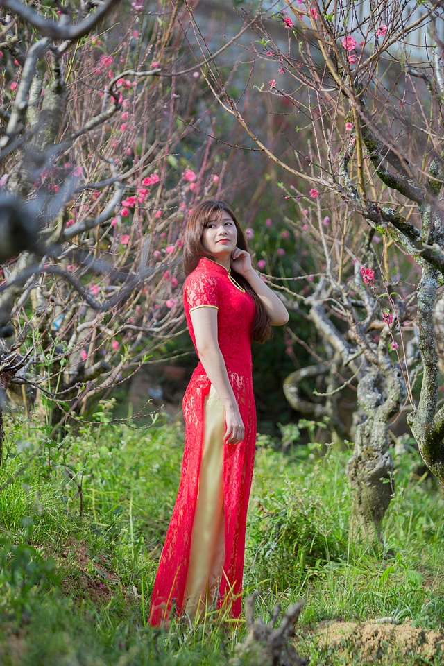 beautiful young Chinese girl smiling in spring garden