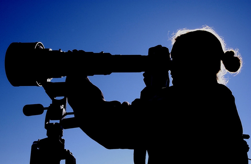 silhouette photographer at sunset