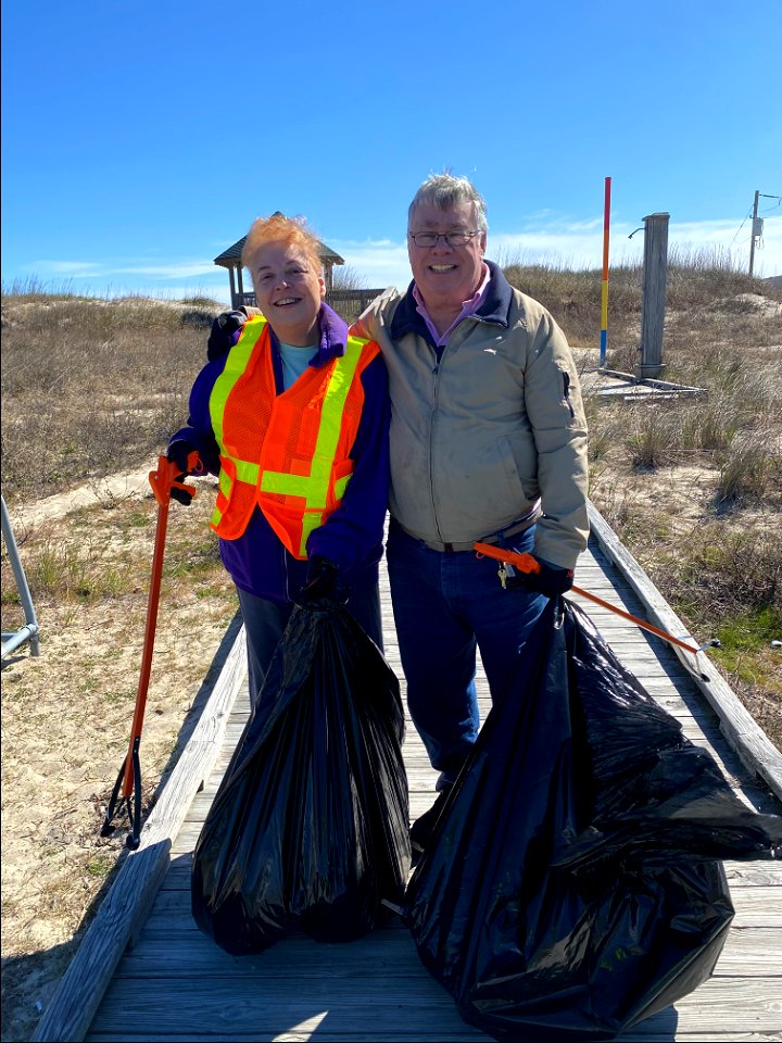 Volunteers/Outer Banks lighthouse fans, stand proudly with their collected beach debris