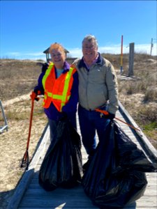 Volunteers/Outer Banks lighthouse fans, stand proudly with their collected beach debris