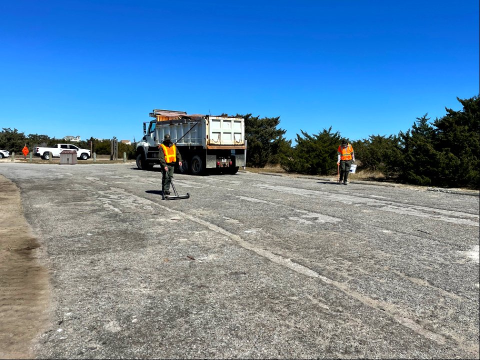 National Park Service employees clean up the Ramp 23 parking area photo
