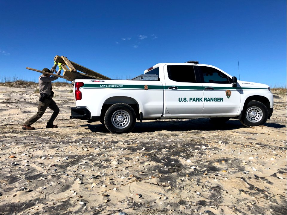 Park Ranger Cleaning the Beach