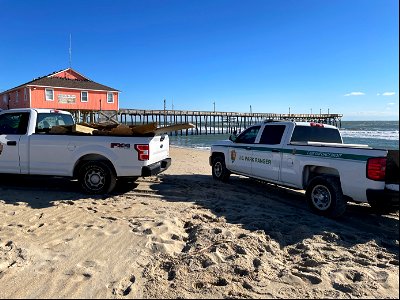 Two vehicles with debris just south of the Rodanthe Pier. photo