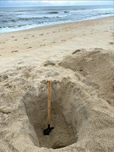 Beach hole in front of village of Avon