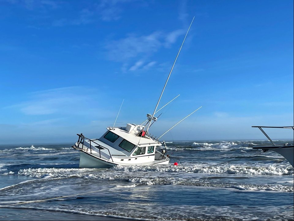 Vessel named Reel Lucky on beach 02-03-2022