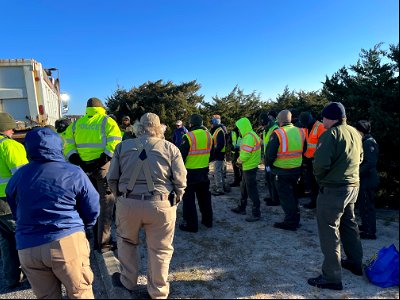 National Park Service employees receive safety briefing in cold temperatures the morning of March 15