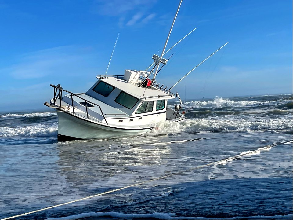 Vessel named Reel Lucky on beach 02-03-2022