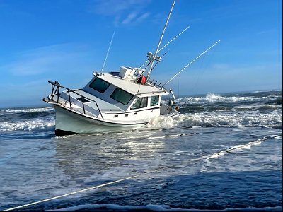 Vessel named Reel Lucky on beach 02-03-2022