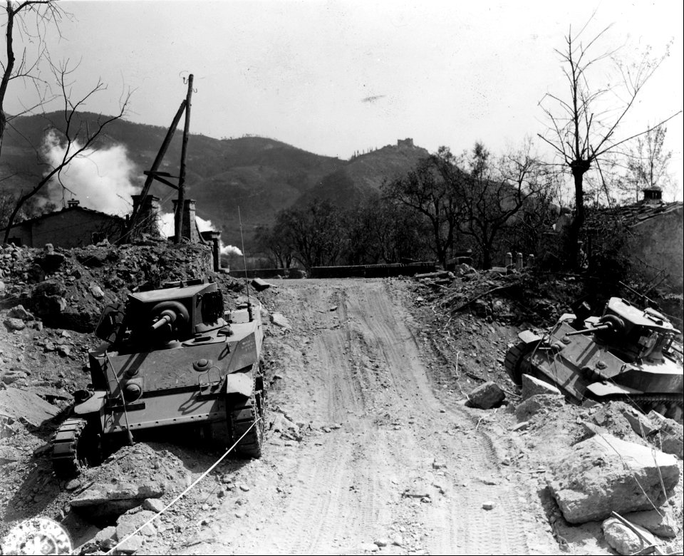 SC 337148 - Two knocked out tanks are left along the road about 1/2 miles outside Massa. This is a German tank ditch. 10 April, 1945.