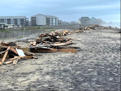 Piles of collected debris associated with collapsed houses photo