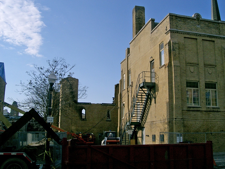 Construction workers repairing church building