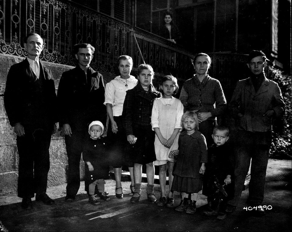 SC 404990 - This Russian family, taken to Luxembourg by the Germans soon after its occupation and put to work in factories await the day they can return, two of the children were born after their parents were conscripted. 29 October, 1944.