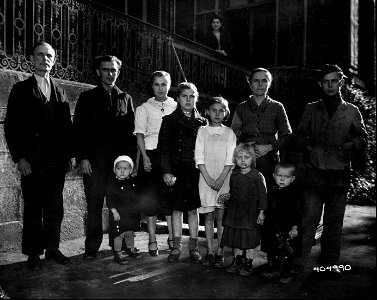 SC 404990 - This Russian family, taken to Luxembourg by the Germans soon after its occupation and put to work in factories await the day they can return, two of the children were born after their parents were conscripted. 29 October, 1944.