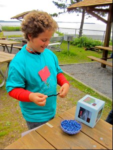 Collecting beads water station photo