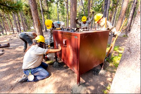 YCC Alpha Crew 2021 Canyon Campground bear box installation: setting feet and digging hole for support post