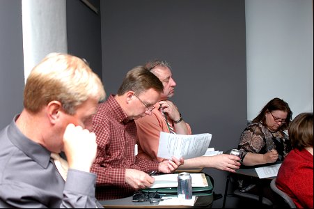 Observers from FWS and DNR take notes during the listening session