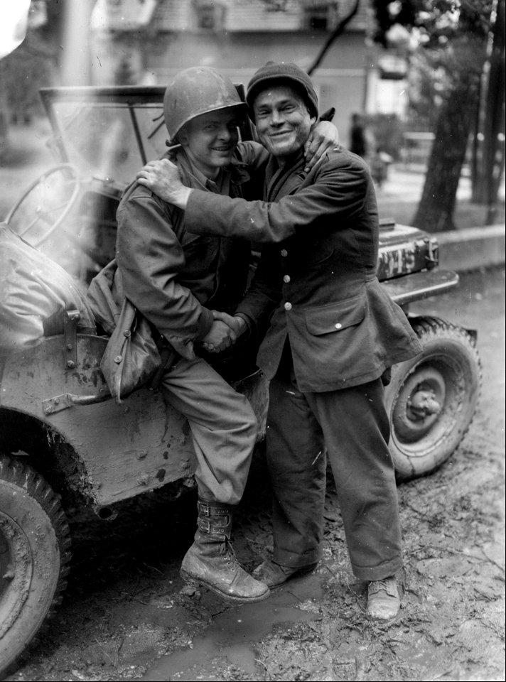 SC 337121 - Pvt. Wallace F. Burket, left, bazooka man with the 80th Infantry Division, U.S. Third Army, finds his brother, Sgt. Wm. C. Burket... photo
