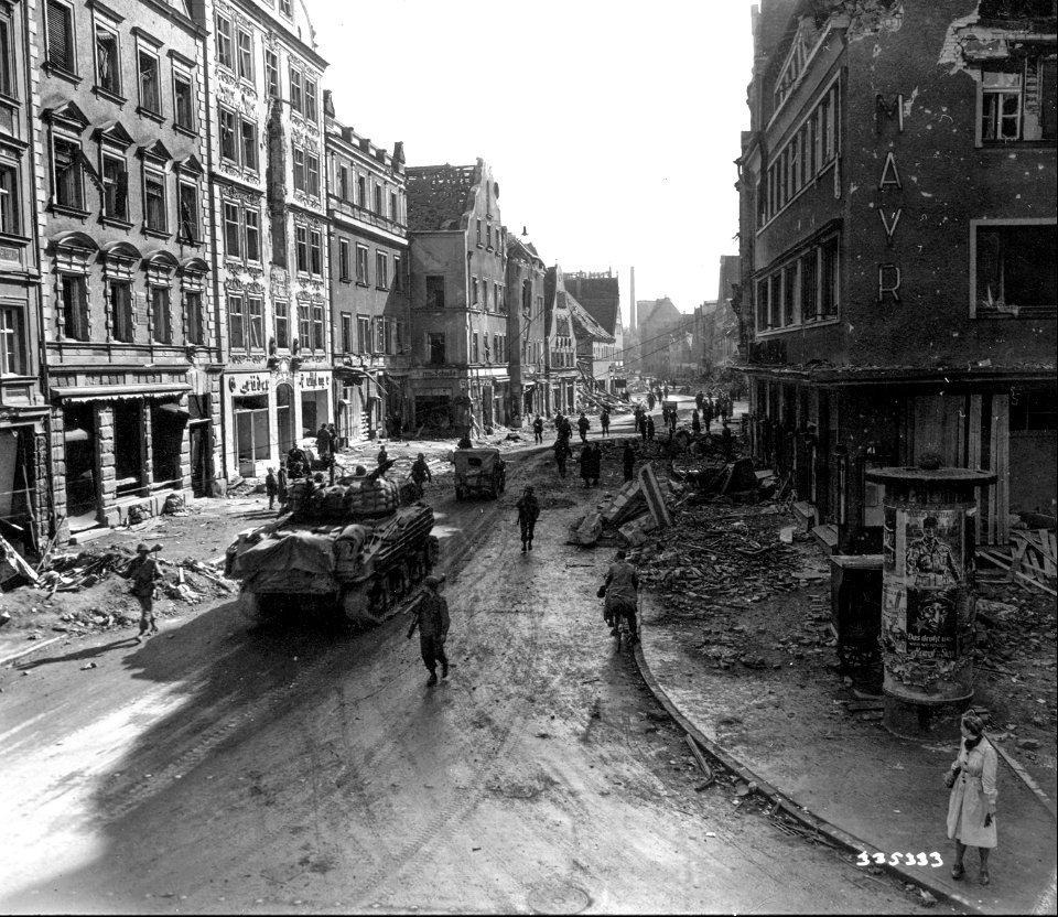 SC 335333 - Doughboys, tanks and other vehicles of the 86th Division, U.S. Third Army, push through the ruined town of Ingolstadt, Germany. 27 April, 1945.