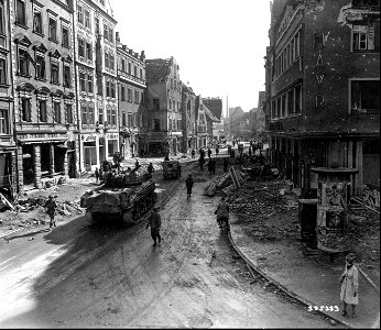 SC 335333 - Doughboys, tanks and other vehicles of the 86th Division, U.S. Third Army, push through the ruined town of Ingolstadt, Germany. 27 April, 1945. photo