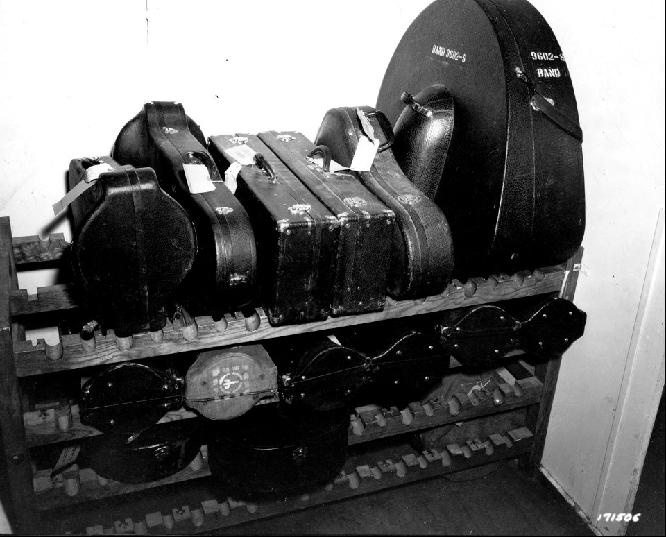 SC 171506 - Instruments of the band of a medical detachment stacked in a baggage room of the transport on which the unit embarked for overseas.