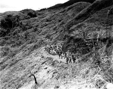 SC 270705 - With the 6th Inf. Div. in the Cagayan Valley, Luzon, P.I., about 9 miles north of Bagabag along Highway 4. photo