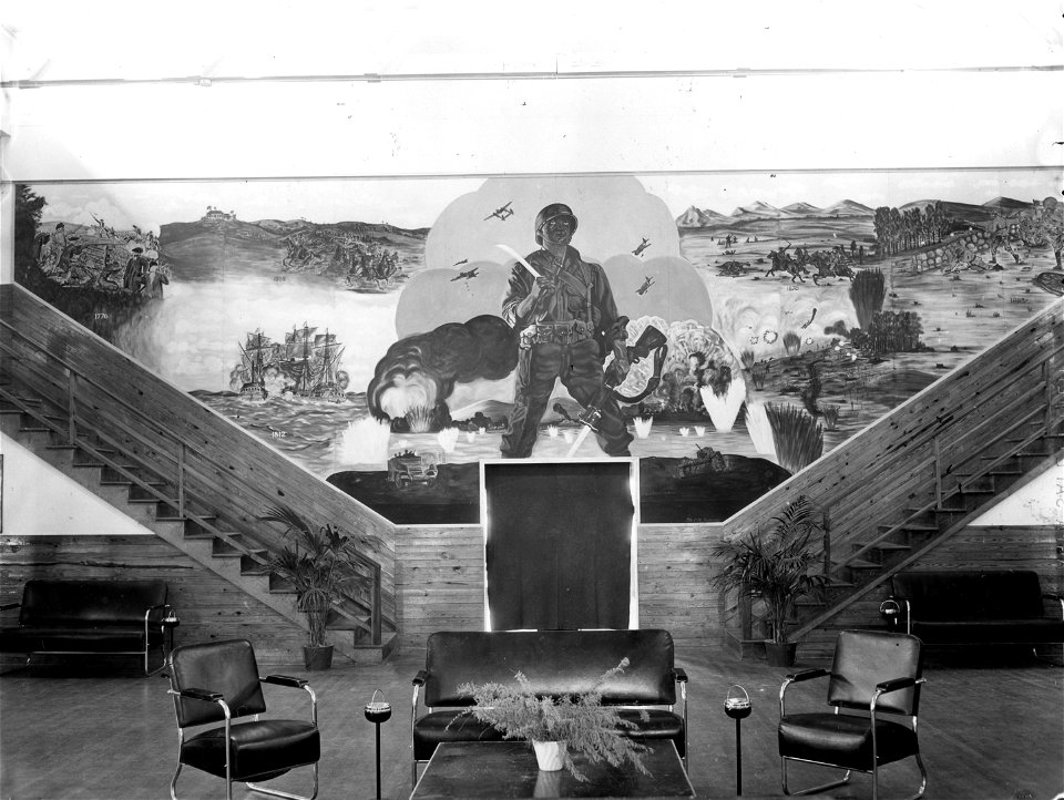 SC 374641 - At Service Club #2, the mural, by Pfc. Rautledge, Special Service Office, covers the entire rear wall.