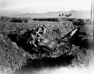 SC 170582 - Photo shows soldiers driving jeep through a ditch, resulting in a rough ride, tossing the men out of seats and over the driver's head.