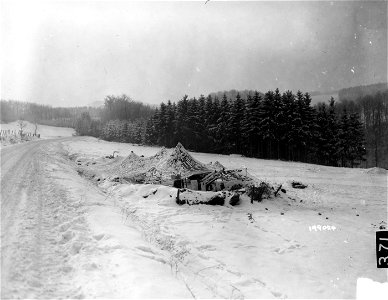 SC 199024 - This 105mm howitzer is in a camouflaged position on the U.S. Third Army front near Haller, Luxembourg. 12 January, 1945. photo