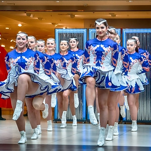 Cheerleader and dancer performing on stage