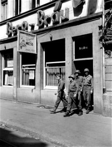 SC 335293 - Soldiers riding army convoys through old Heidelberg, picturesque German university town in the Neckar Valley, eat at this German restaurant which has been turned into a mess and refreshment center by CONAD Special Services. 11 May, 1945.