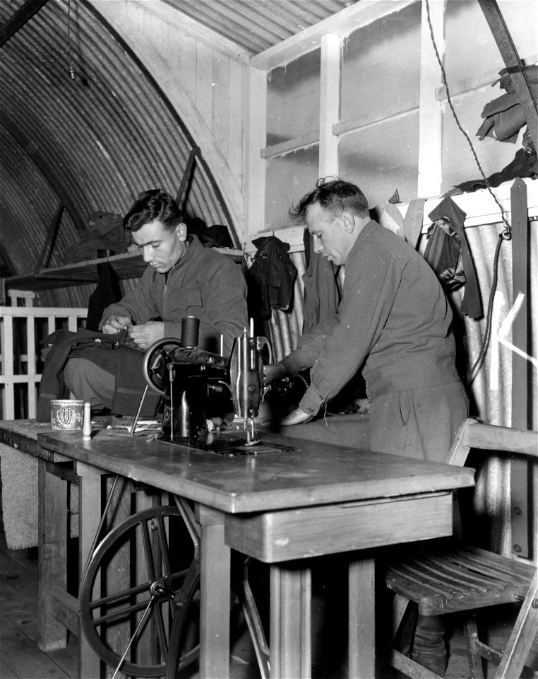 SC 405008 - Russian tailors use German equipment in a camp for liberated Russians at Rennes, France, to make all their own clothes with the exception of U.S. Army fatigues which the Army gives them.